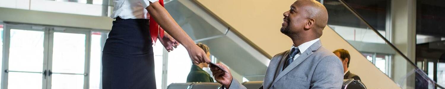 Successful Kenyan passport application - traveler at JKIA with new biometric passport, travel ready